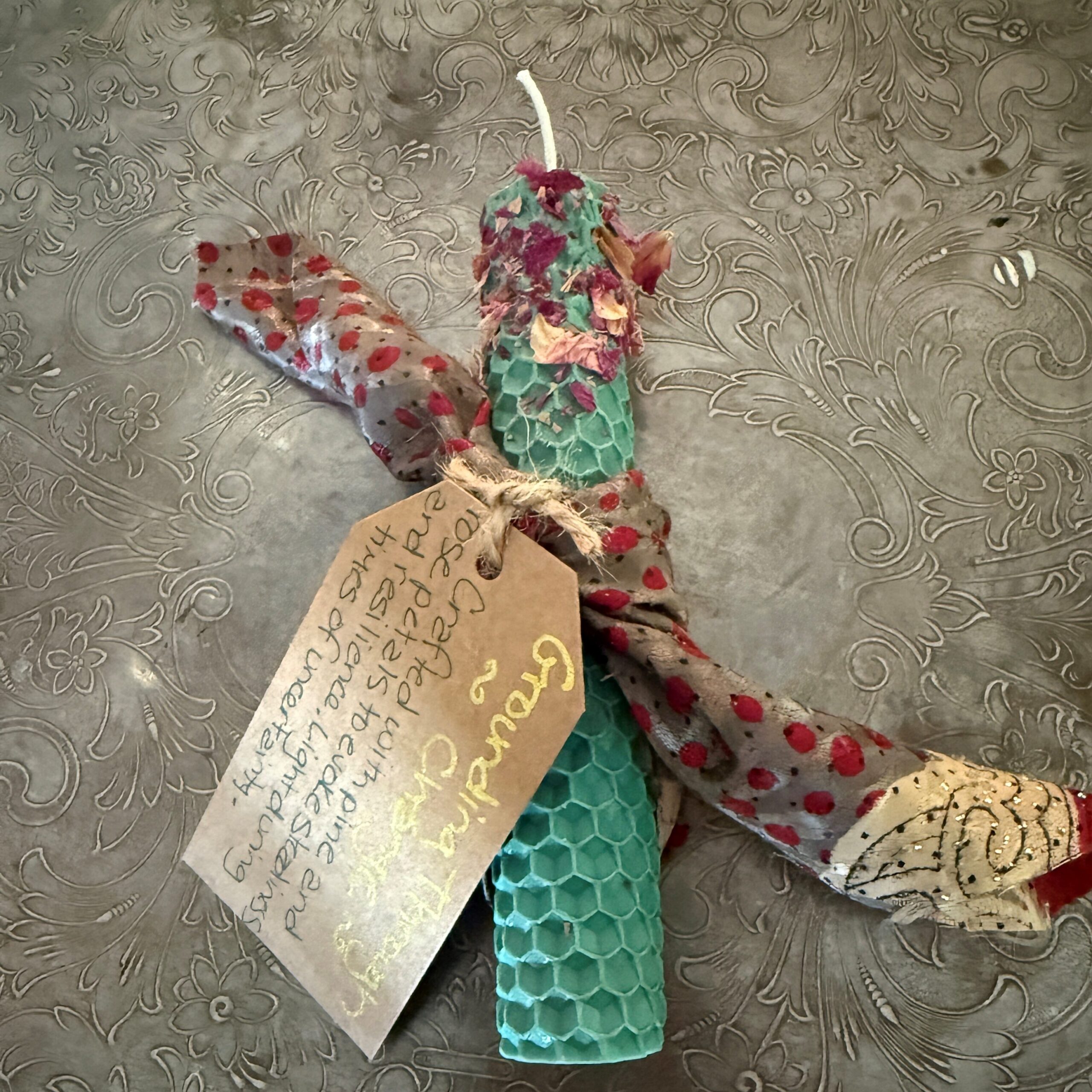 intention candle anointed with rose petals and wrapped with sari silk